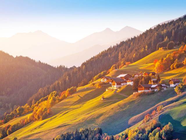 Homes on sloping hillside in Alps of Switzerland