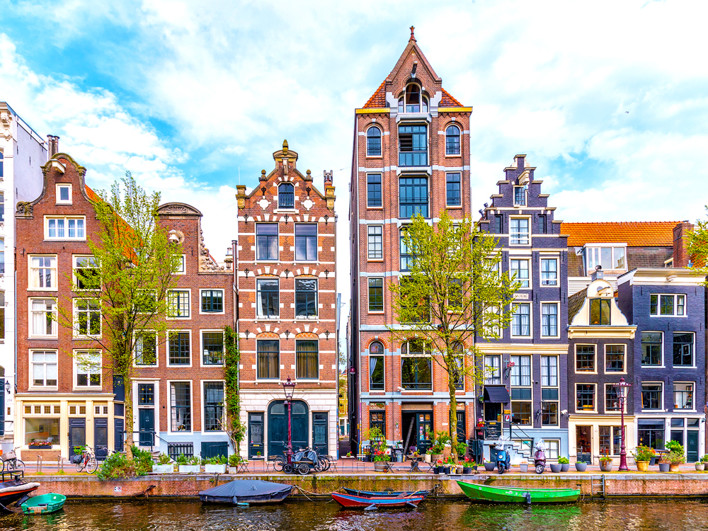 Traditional Dutch row homes along canal in Amsterdam, Netherlands
