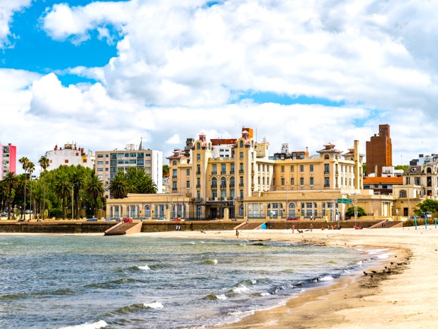 Sandy beach and waterfront buildings in Montevideo, Uruguay