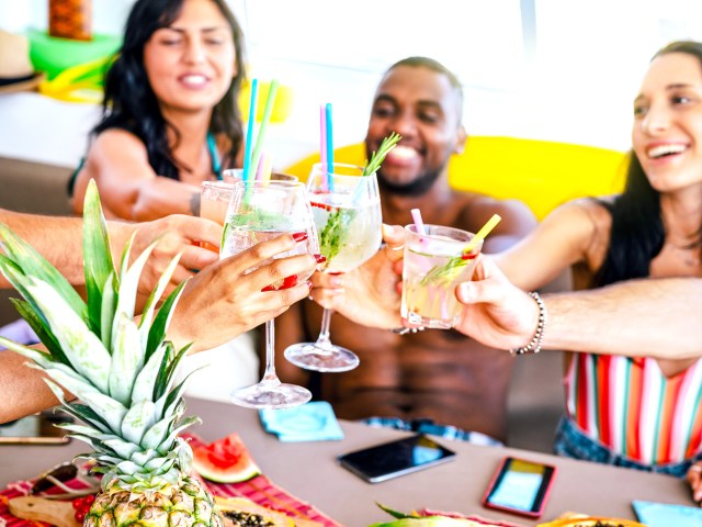 Group of people toasting with cocktails