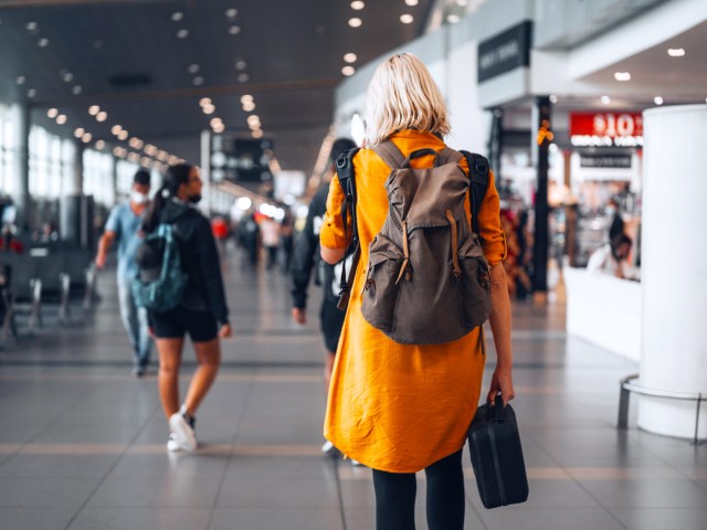 Travelers with baggage at airport