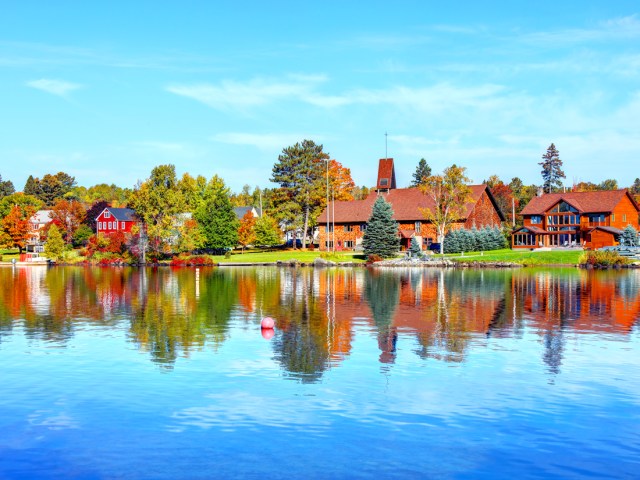 Buildings reflecting on waters of Rangeley Lake in Maine