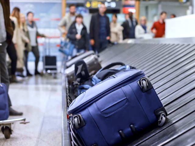 Luggage on airport baggage claim carousel
