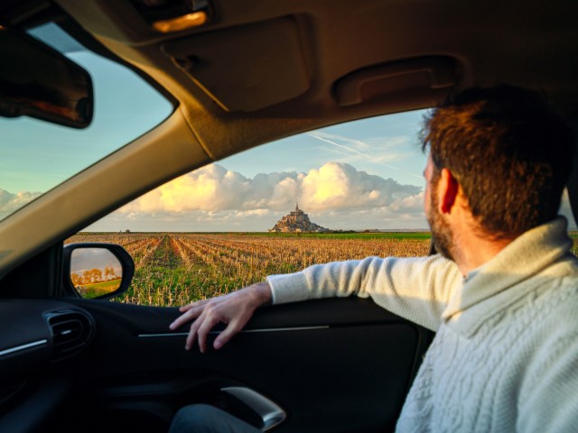 Car passenger admiring view out of window
