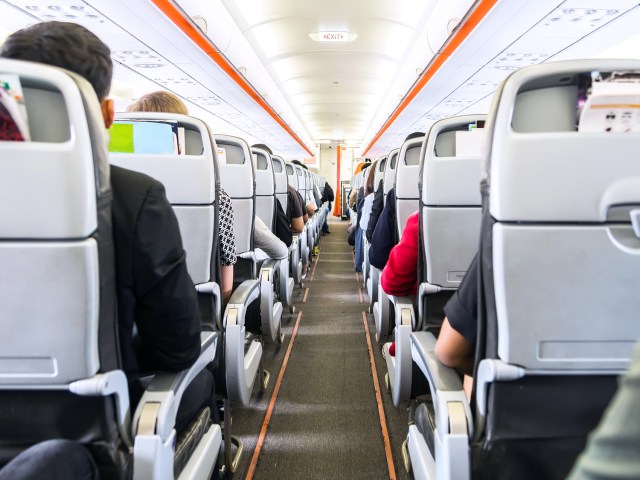 Image of aircraft aisle from back to front