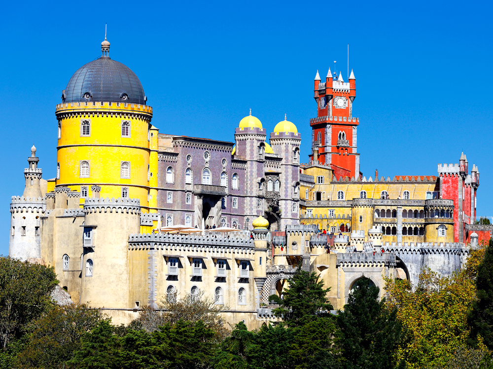 Brightly colored towers of Pena Palace in Sintra, Portugal