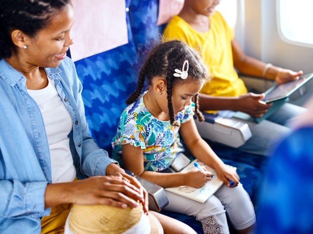 Family seated together on airplane