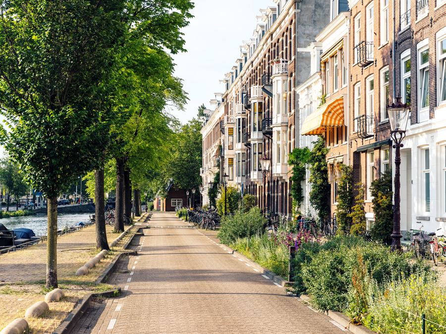 Bike path beside row homes in Amsterdam, Netherlands