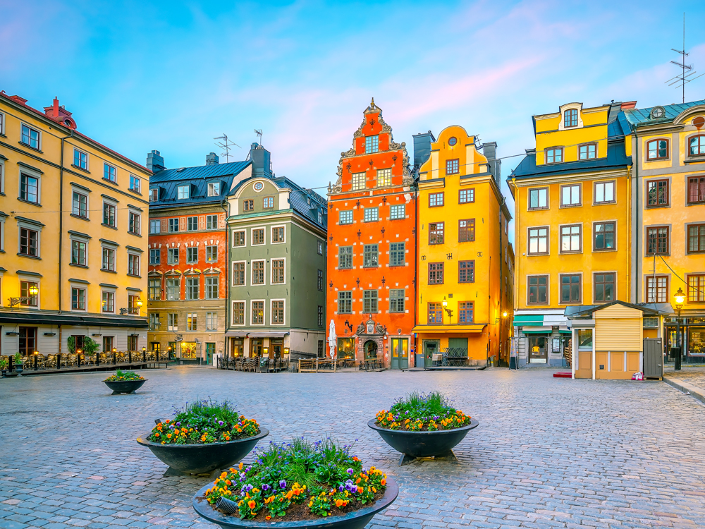 Colorful buildings lining cobblestone square in Stockhom Old Town