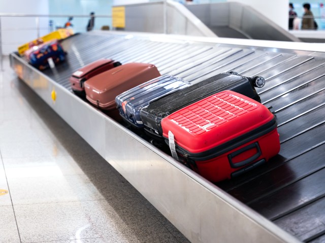 Baggage arriving on airport carousel 