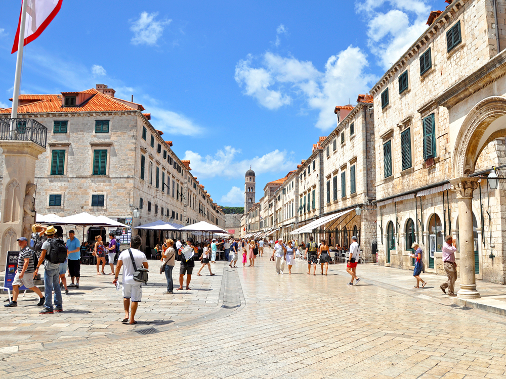 Pedestrians strolling the Stradun in Dubrovnik, Croatia