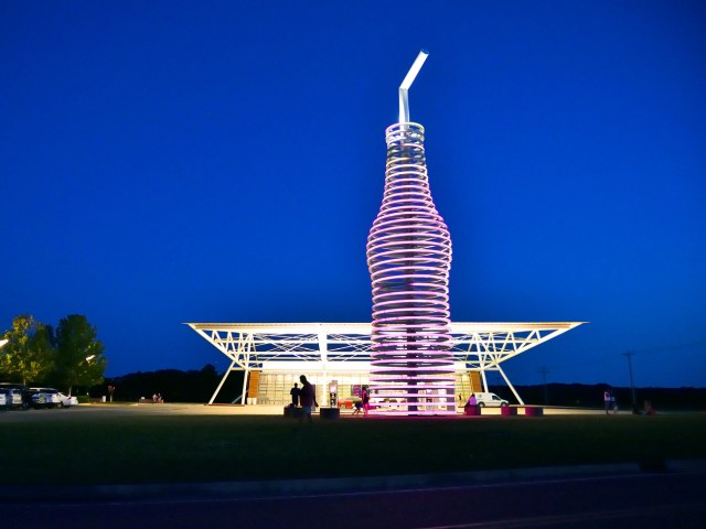 Giant soda bottle installation, seen at night, at Pops 66 Soda Ranch in Arcadia, Oklahoma
