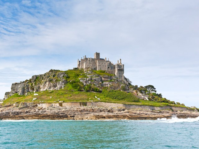 Hilltop castle on St. Michael’s Mount in Cornwall, England, seen from afar