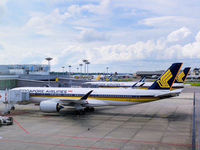 Singapore Airlines aircraft parked at gates