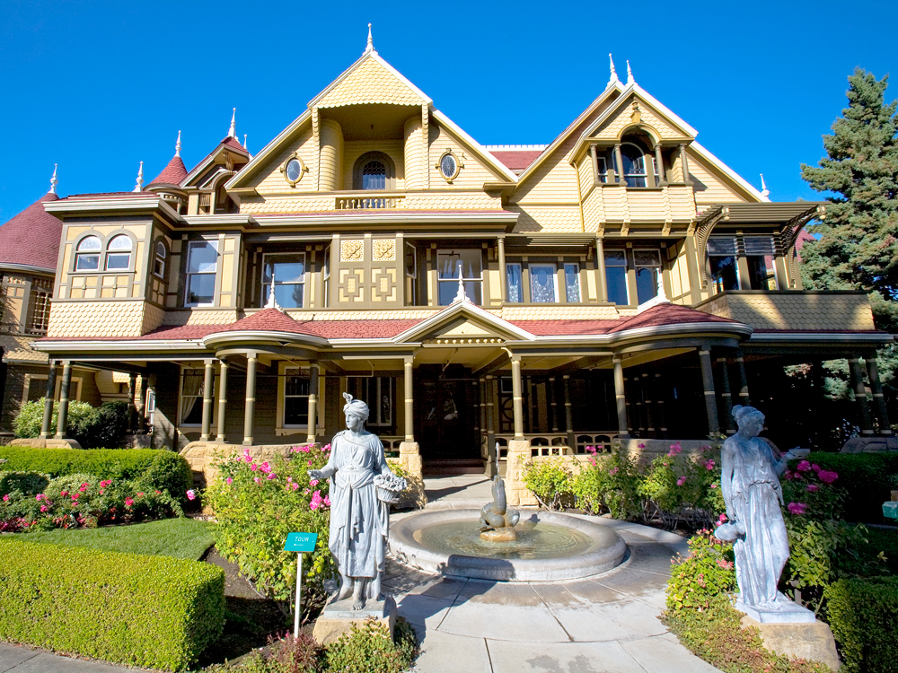 Fountain and pair of statues in front of Winchester Mystery House in San Jose, California