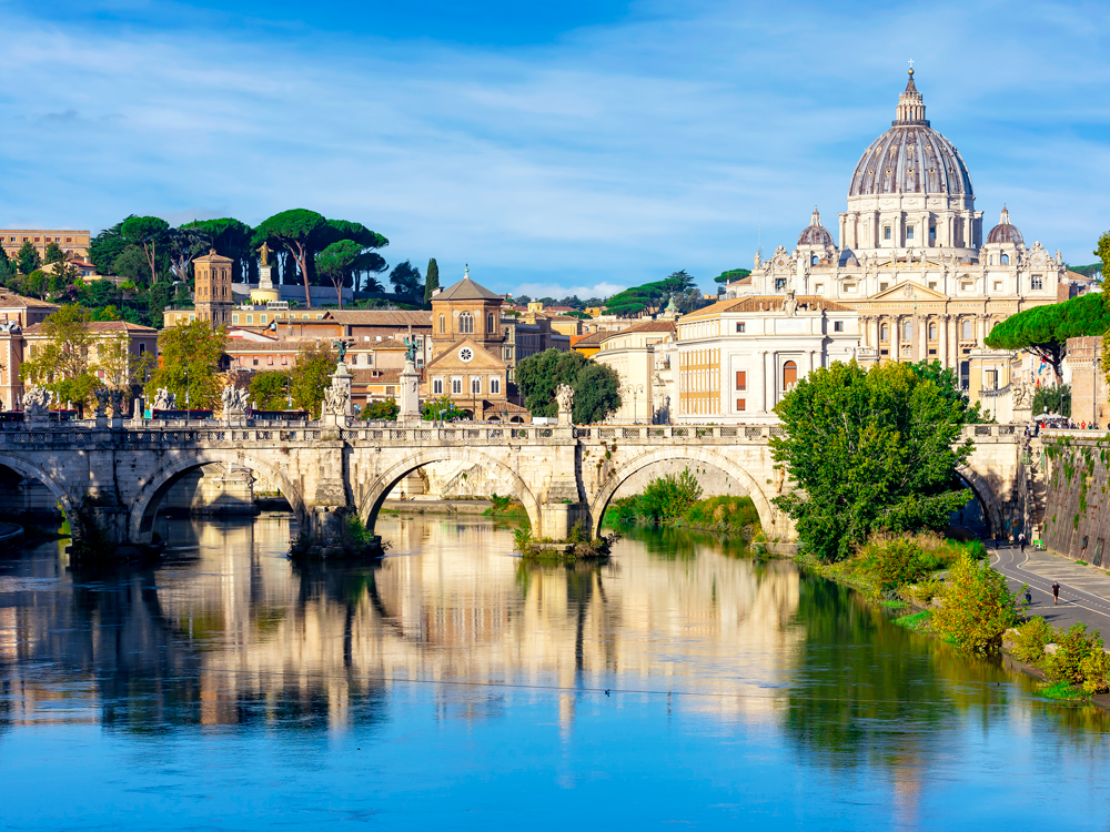 St. Peter's Basilica in Vatican City, seen from across River Tiber in Rome, Italy