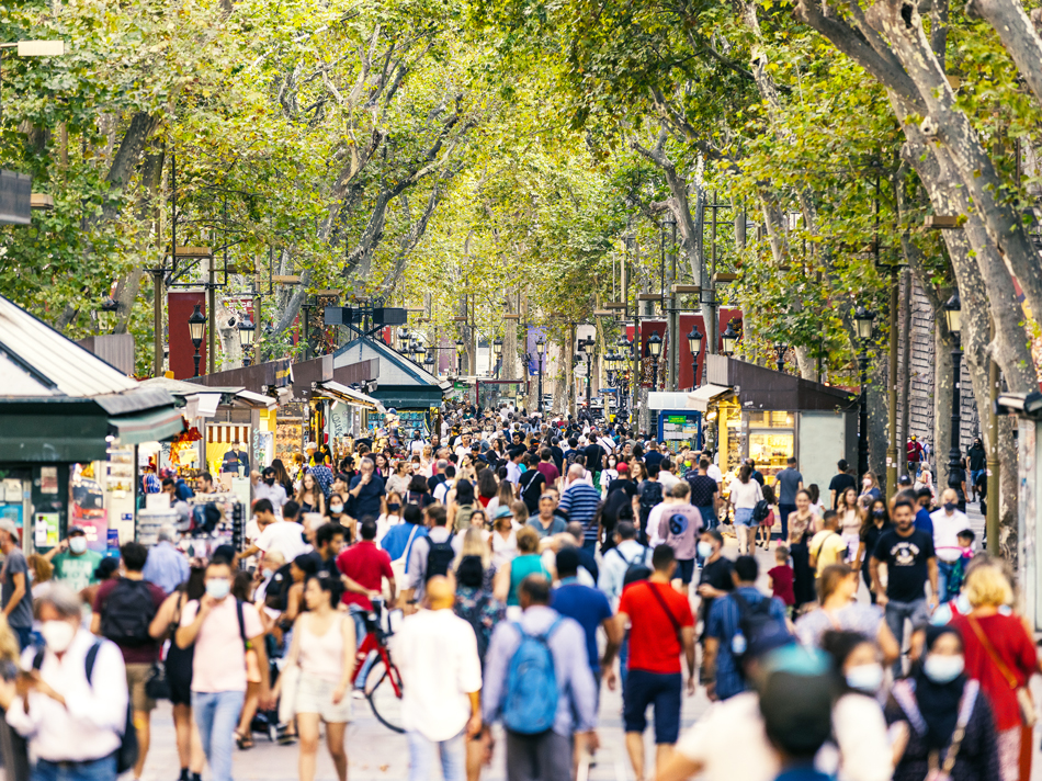 Crowds of tourists at La Ramblas in Barcelona, Spain