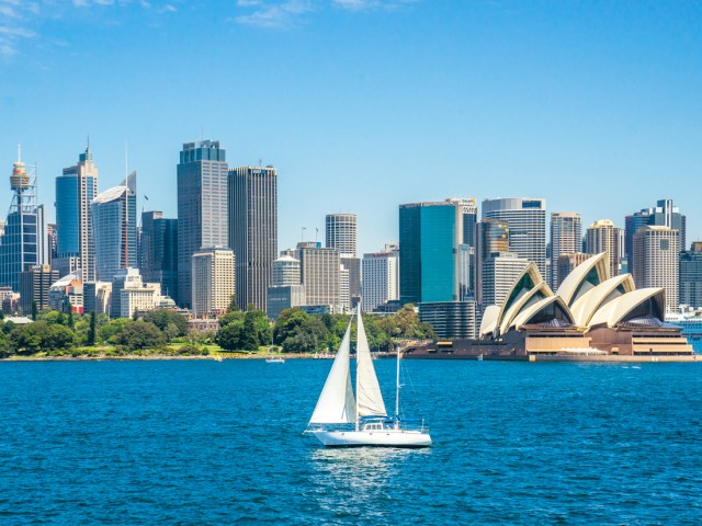 Sailboat in Sydney Harbour with view of Sydney Opera House