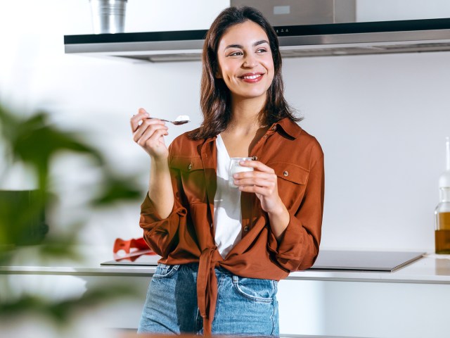 Person eating yogurt