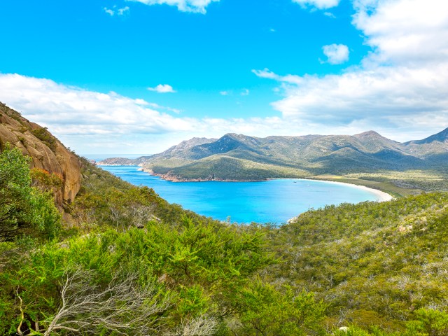 View of Wineglass Bay in Tasmania from surrounding mountains