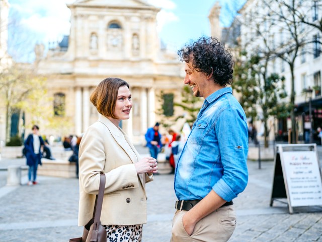 Couple conversing on street