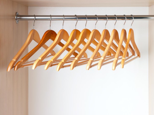 Empty wooden hangers in closet
