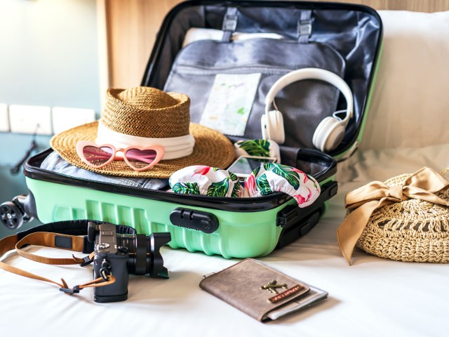 Open suitcase on bed showing contents