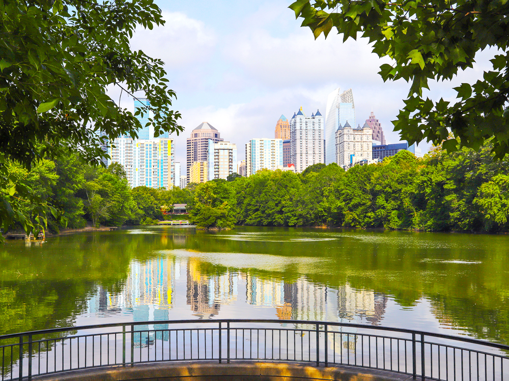 Lake in Atlanta city park with skyscrapers in background