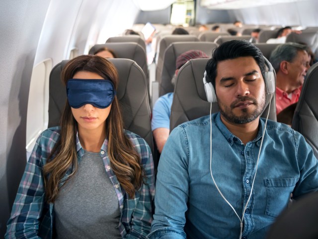 Passengers sleeping on airplane