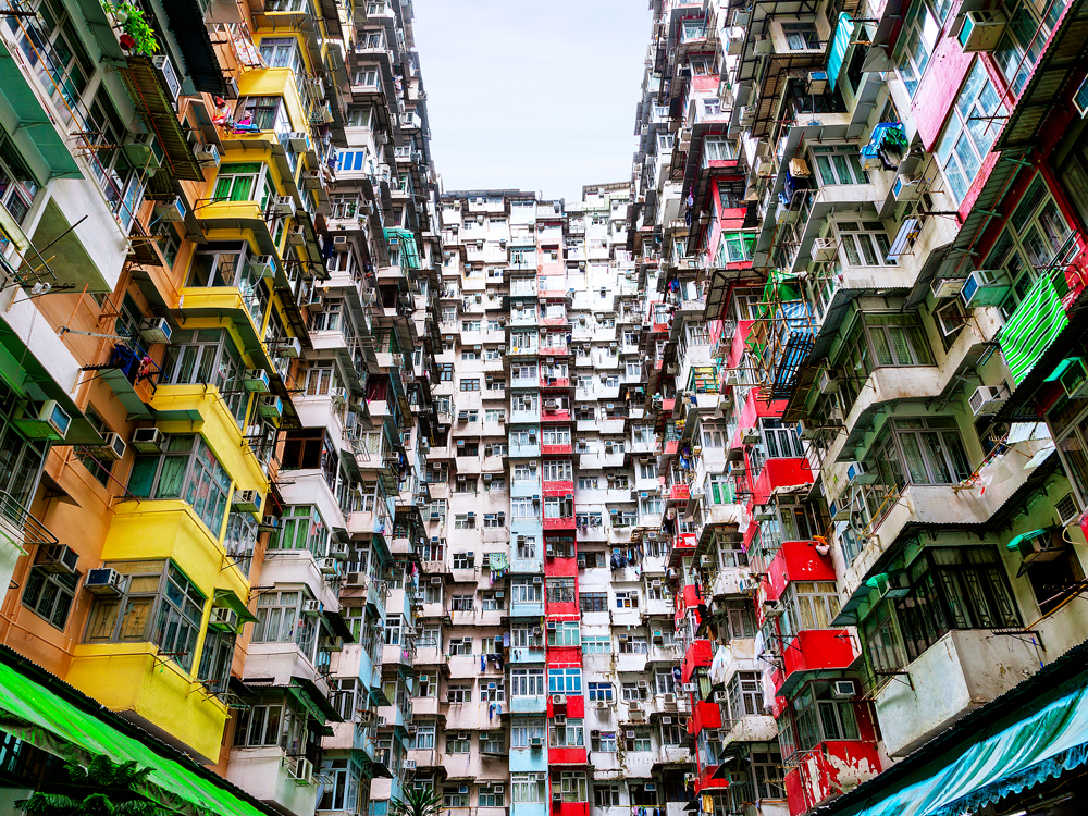 View from interior courtyard of tightly packed residential apartments in Hong Kong's Monster Building