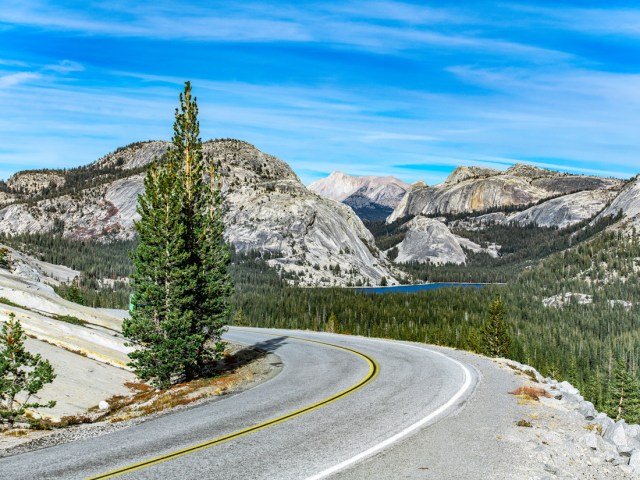 Curve in Tioga Road overlooking mountains of Yosemite National Park, California