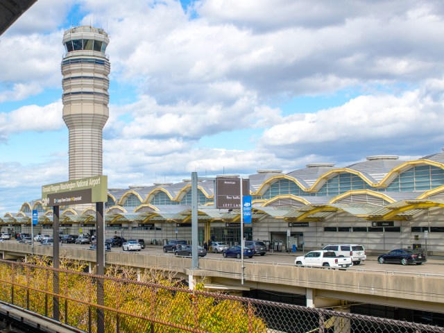 Passenger drop-off area in front of terminal building and control tower at Washington National Airport