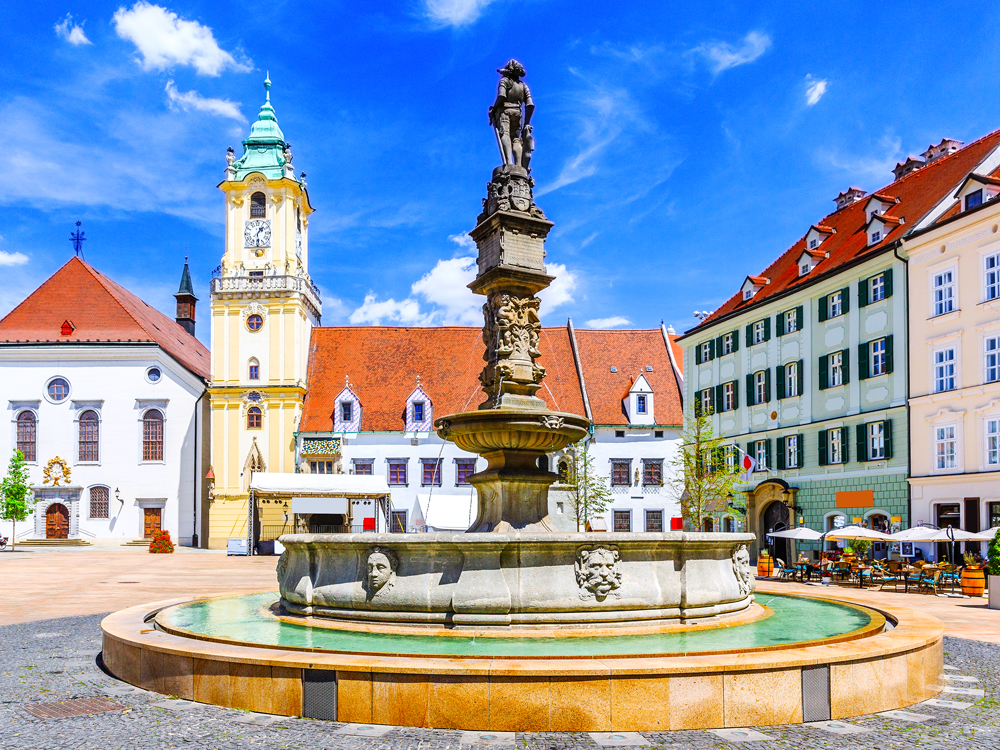 Fountain and church in town square of Bratislava, Slovakia