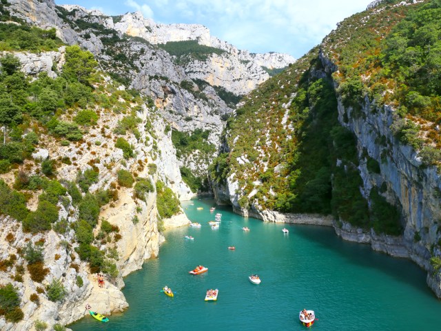Kayaks in the turquoise waters of Les Gorges du Verdon, France, seen from above
