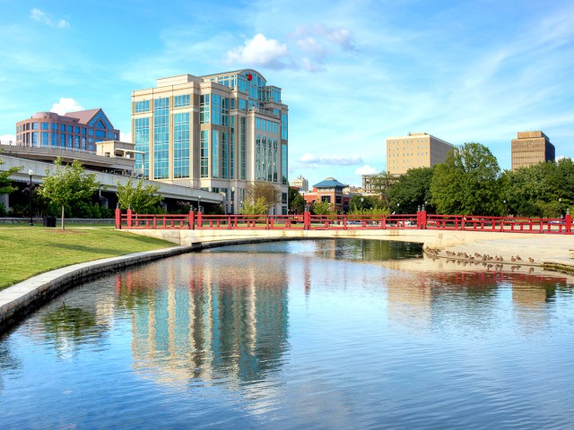 Buildings surrounding lake in city park in Huntsville, Alabama