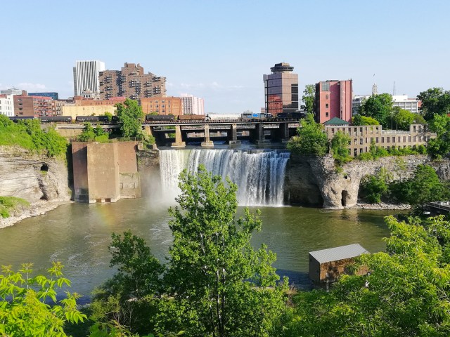 Waterfall in Rochester, New York, with downtown buildings behind