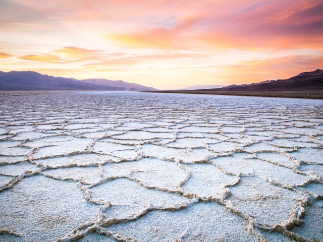 Salt flats of Badwater Basin in Death Valley National Park at sunset