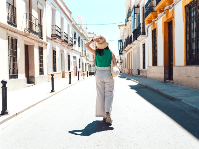 Tourist walking down street