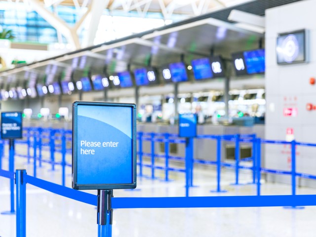 Empty queue at airport check-in counter