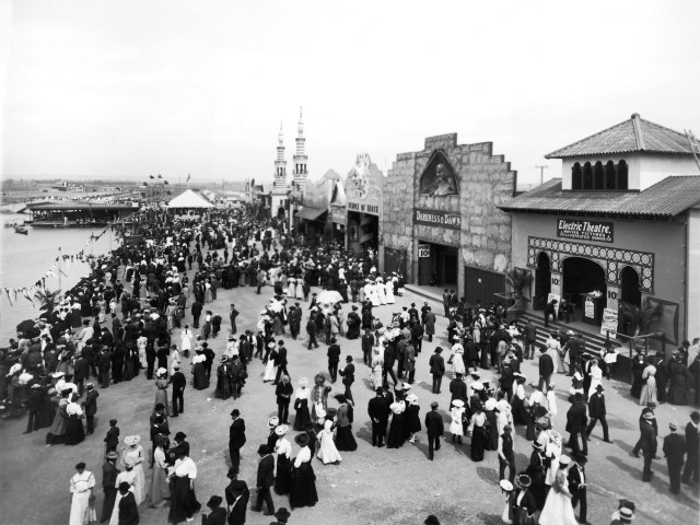 Historical photo of people gathered on boardwalk in Venice Beach, California