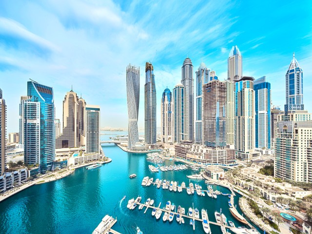 Modern skyscrapers flanking marina in Dubai, United Arab Emirates