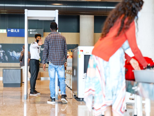 Travelers in security line at airport