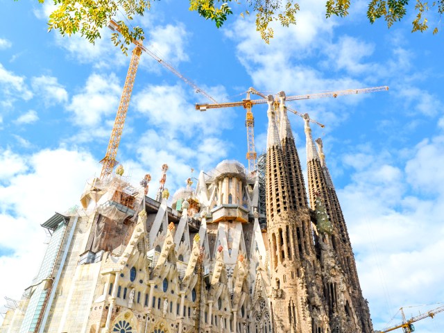 Construction cranes over Barcelona's La Sagrada Familía cathedral