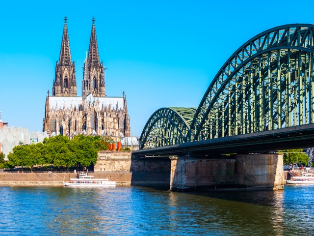 Bridge across Rhine River with view of Cologne Cathedral in Cologne, Germany