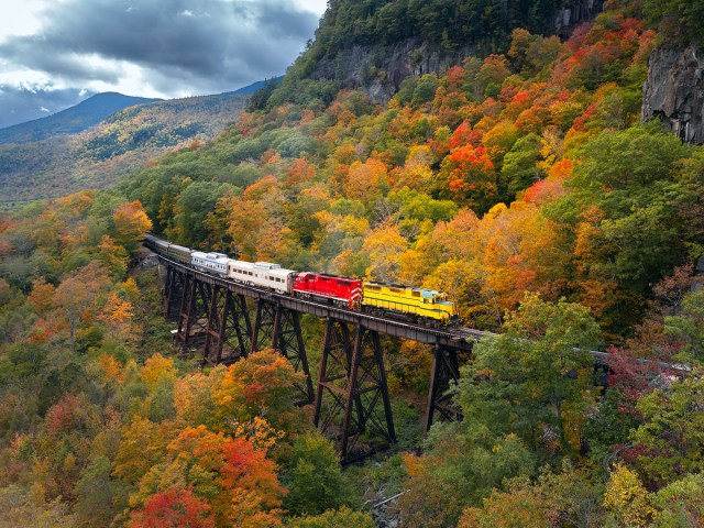 Aerial view of Conway Scenic Railroad and fall foliage of New Hampshire's White Mountains