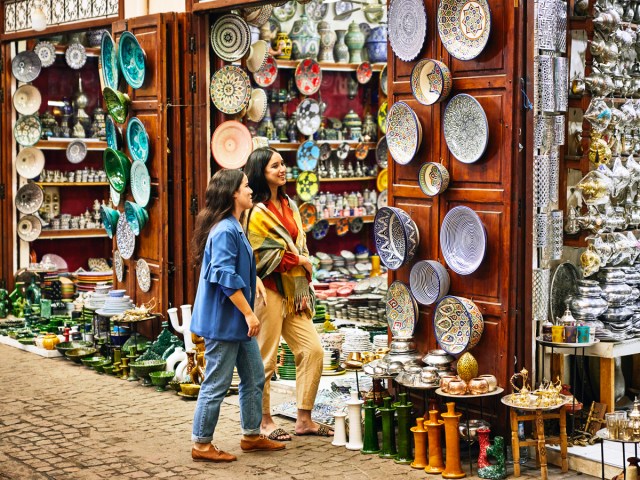 Pair of shoppers looking at ceramics