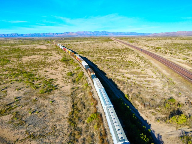 Aerial view of train through Southwest U.S. desert landscape