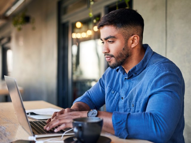 Man typing on laptop