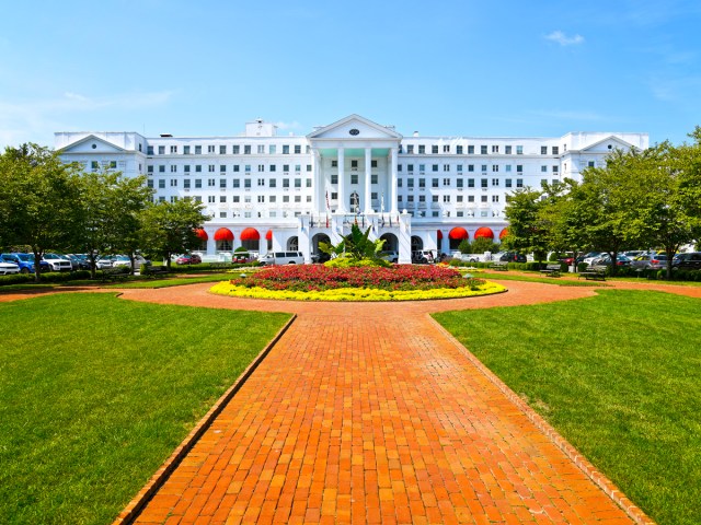 Brick path through manicured gardens leading to Greenbrier Resort in West Virginia