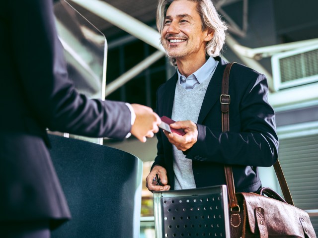 Airline passenger interacting with airport employee